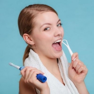 Is tongue brushing necessary? And can any normal toothbrushes be used?